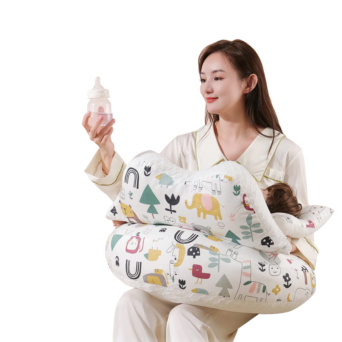 Mother using baby feeding pillow while holding bottle for infant feeding
