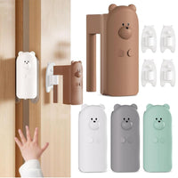 Silicone bear door hinge guard installed on wooden door for child safety

